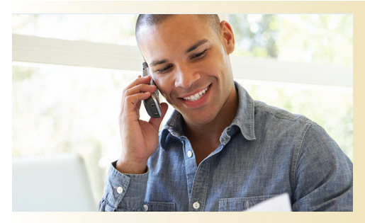 man getting a phone call and smiling